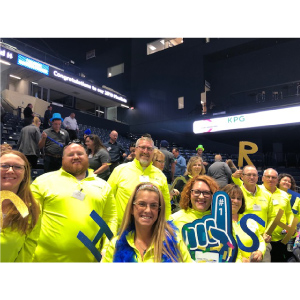 Photo- strategic HR inc team cheering in the stands at the Best Places to Work pep rally